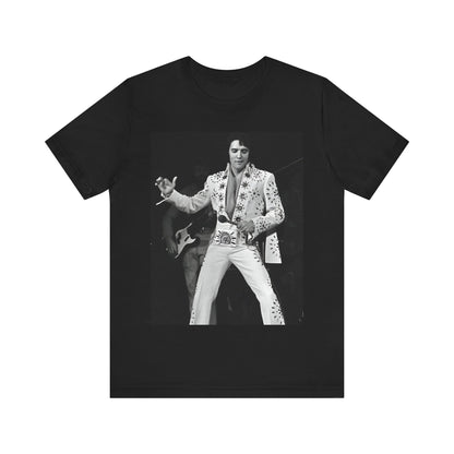 A black graphic t-shirt featuring a stylized graphic of Elvis Presley as The King of Rock 'n' Roll.