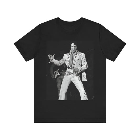 A black graphic t-shirt featuring a stylized graphic of Elvis Presley as The King of Rock 'n' Roll.