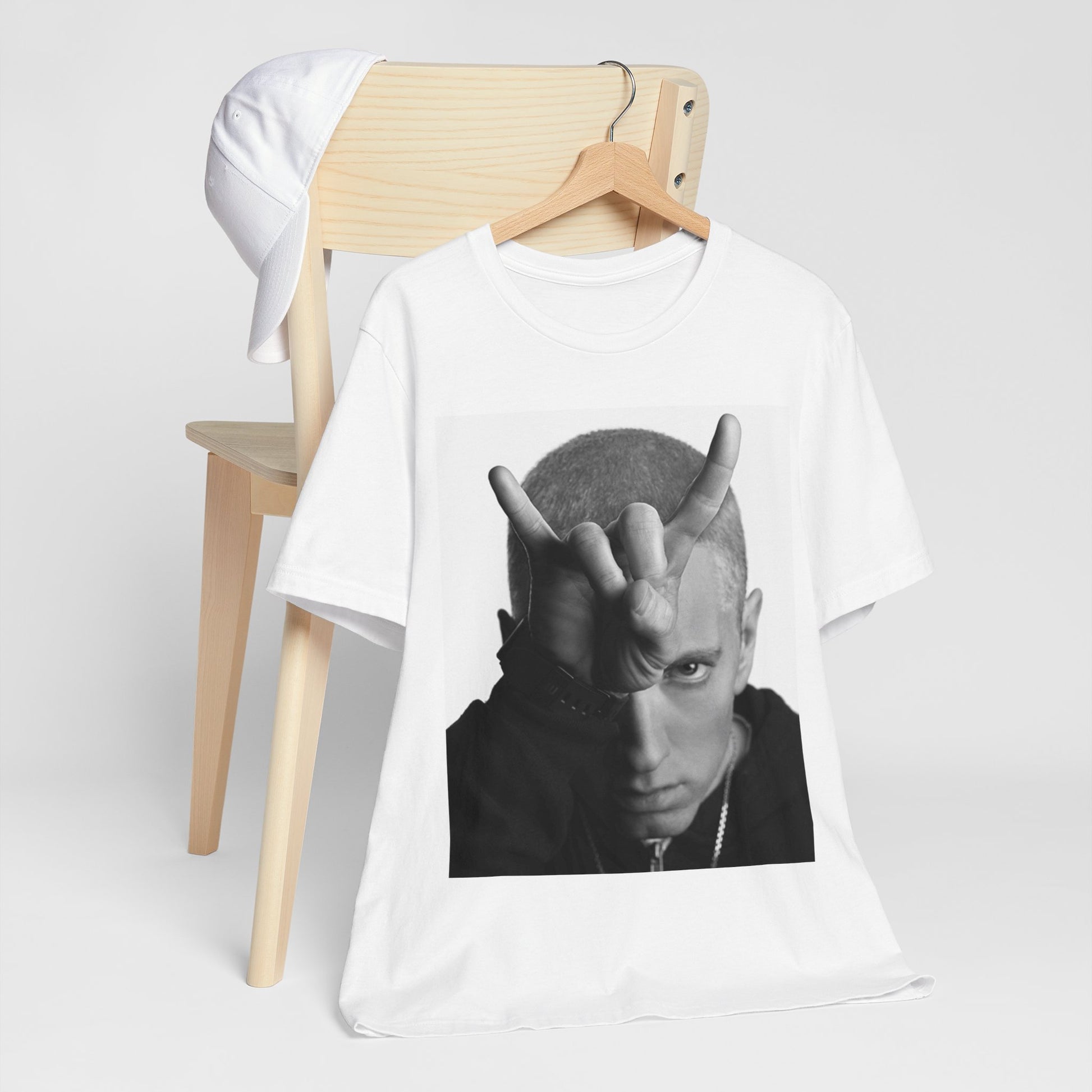 A black graphic t-shirt featuring a graphic related to Eminem's 'My Name Is' song or era.
