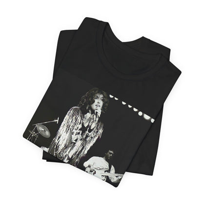 A black graphic t-shirt featuring an 80s black and white photo or graphic of Laura Branigan performing live on stage.