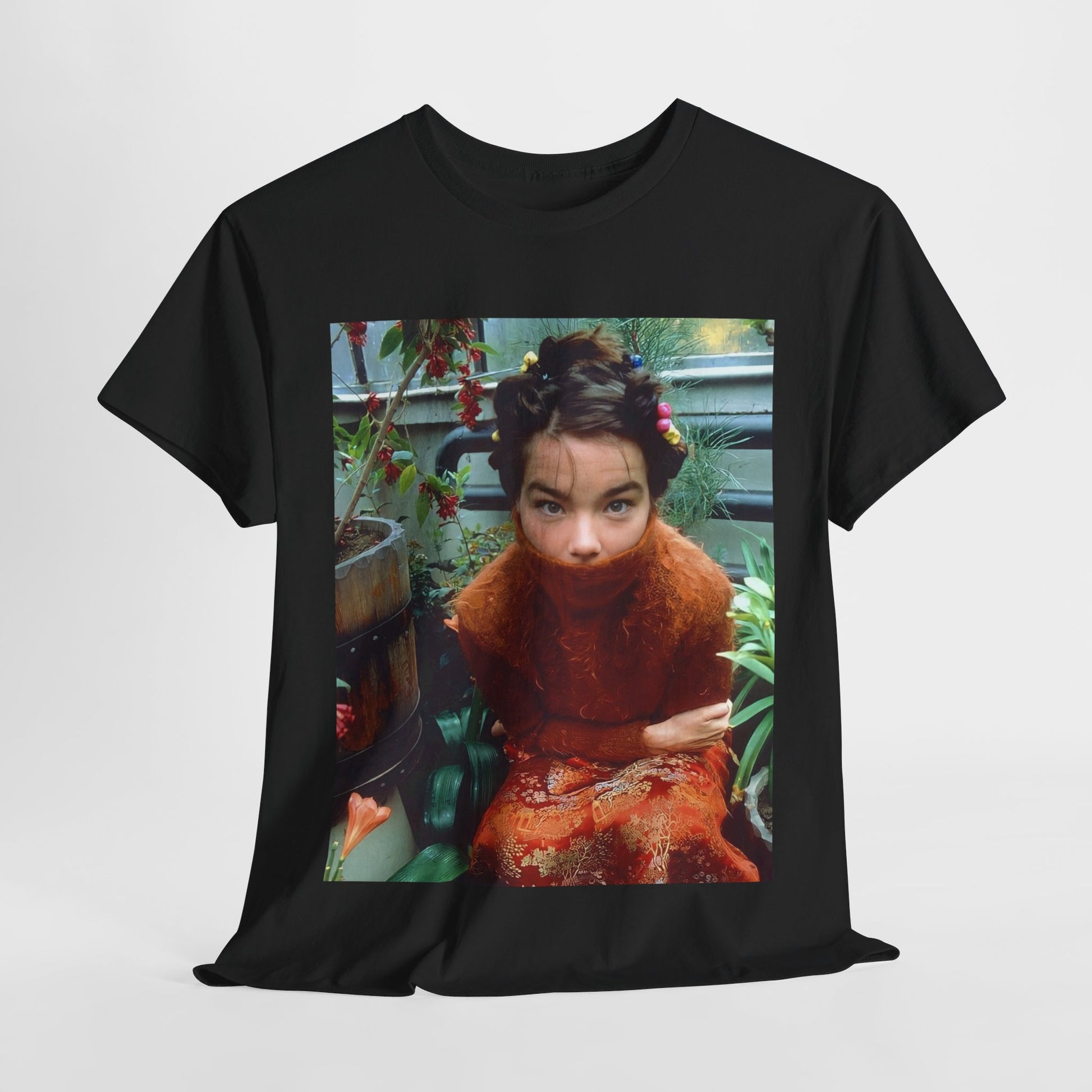 A black graphic t-shirt featuring a dynamic and 'fierce' graphic of Bjork, emphasizing her strong and confident presence.