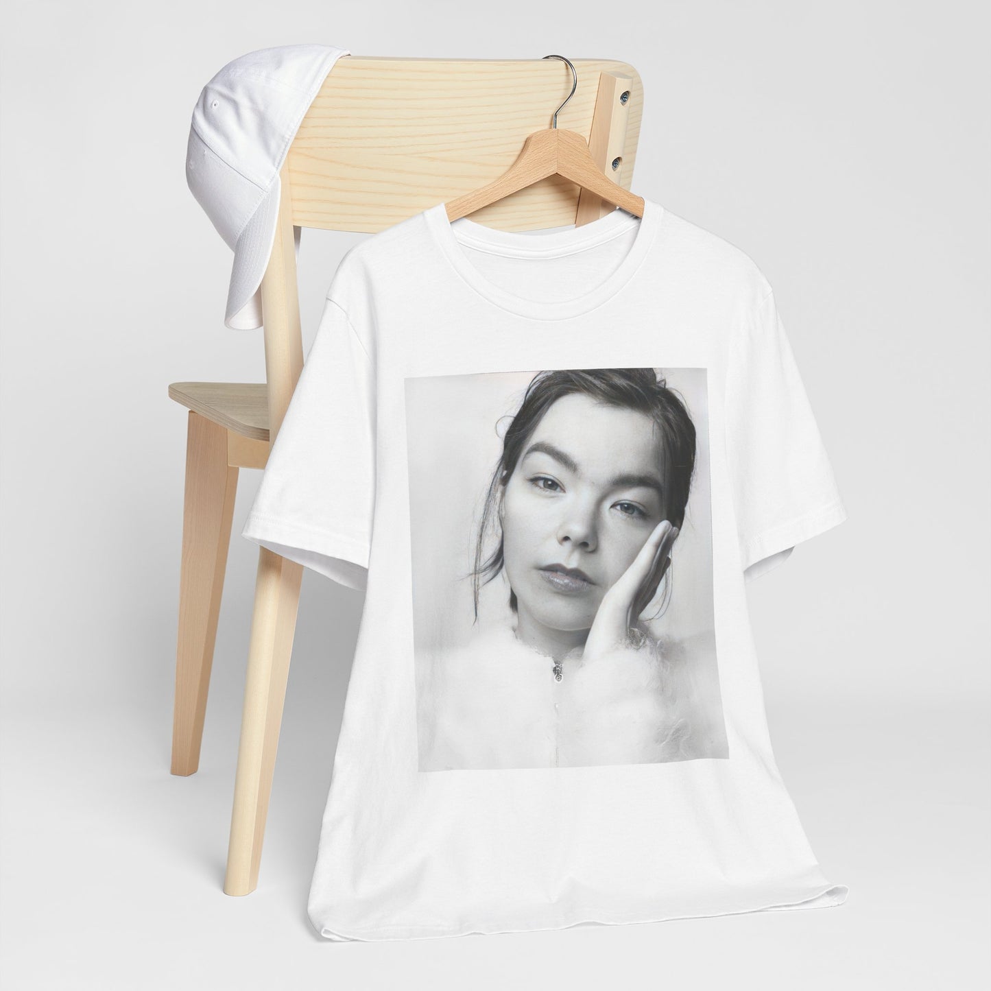 A black graphic t-shirt featuring a graphic related to Bjork's 'Post' album era, possibly with album art elements.