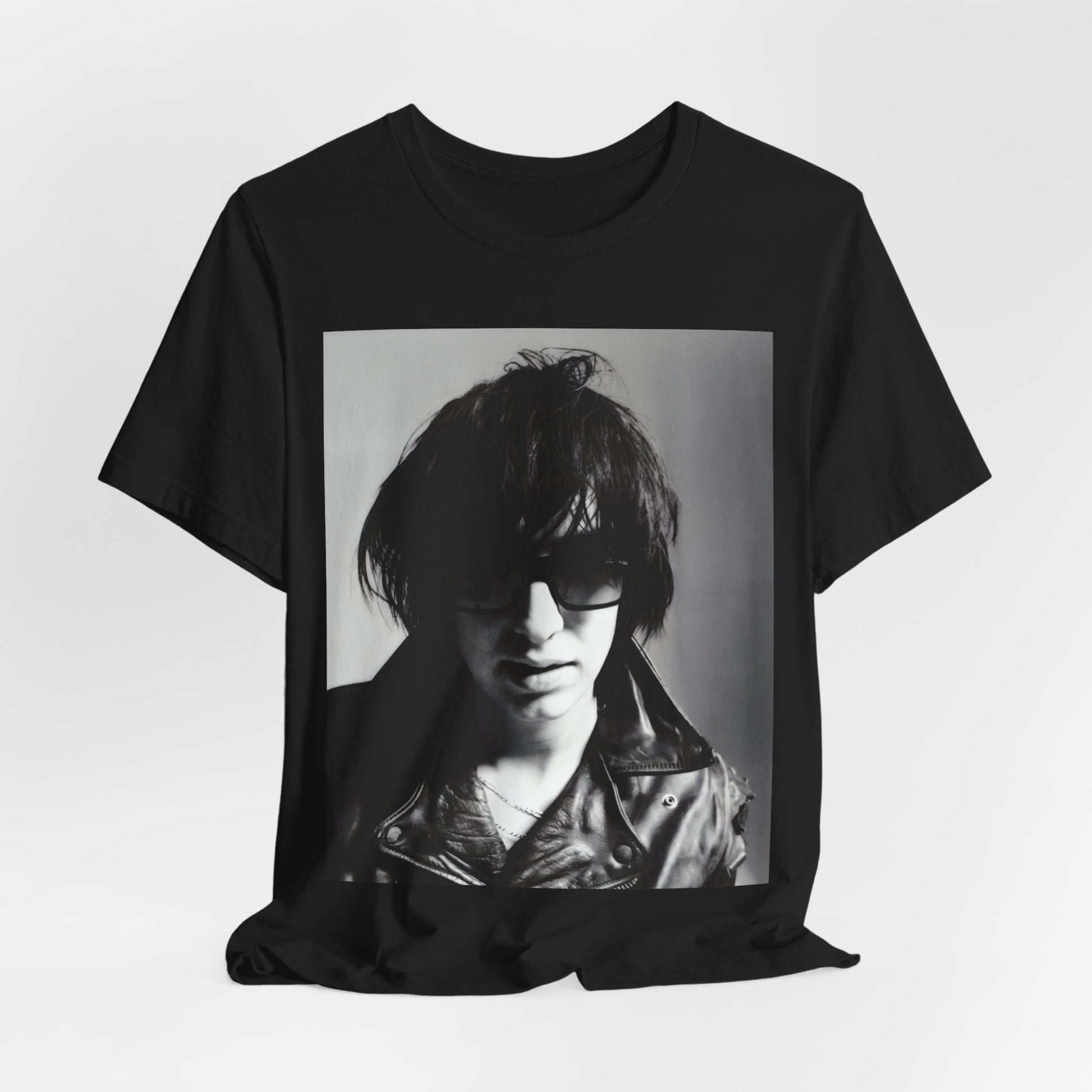 A black graphic t-shirt featuring a graphic related to The Strokes' 'Reptilia' song or era.