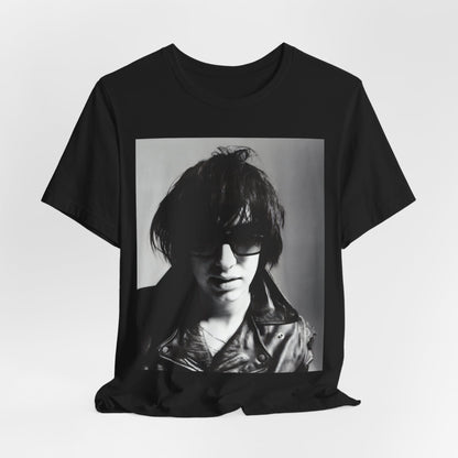 A black graphic t-shirt featuring a graphic related to The Strokes' 'Reptilia' song or era.