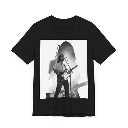 A black graphic t-shirt featuring a black and white, monochrome graphic or photo of Tame Impala.