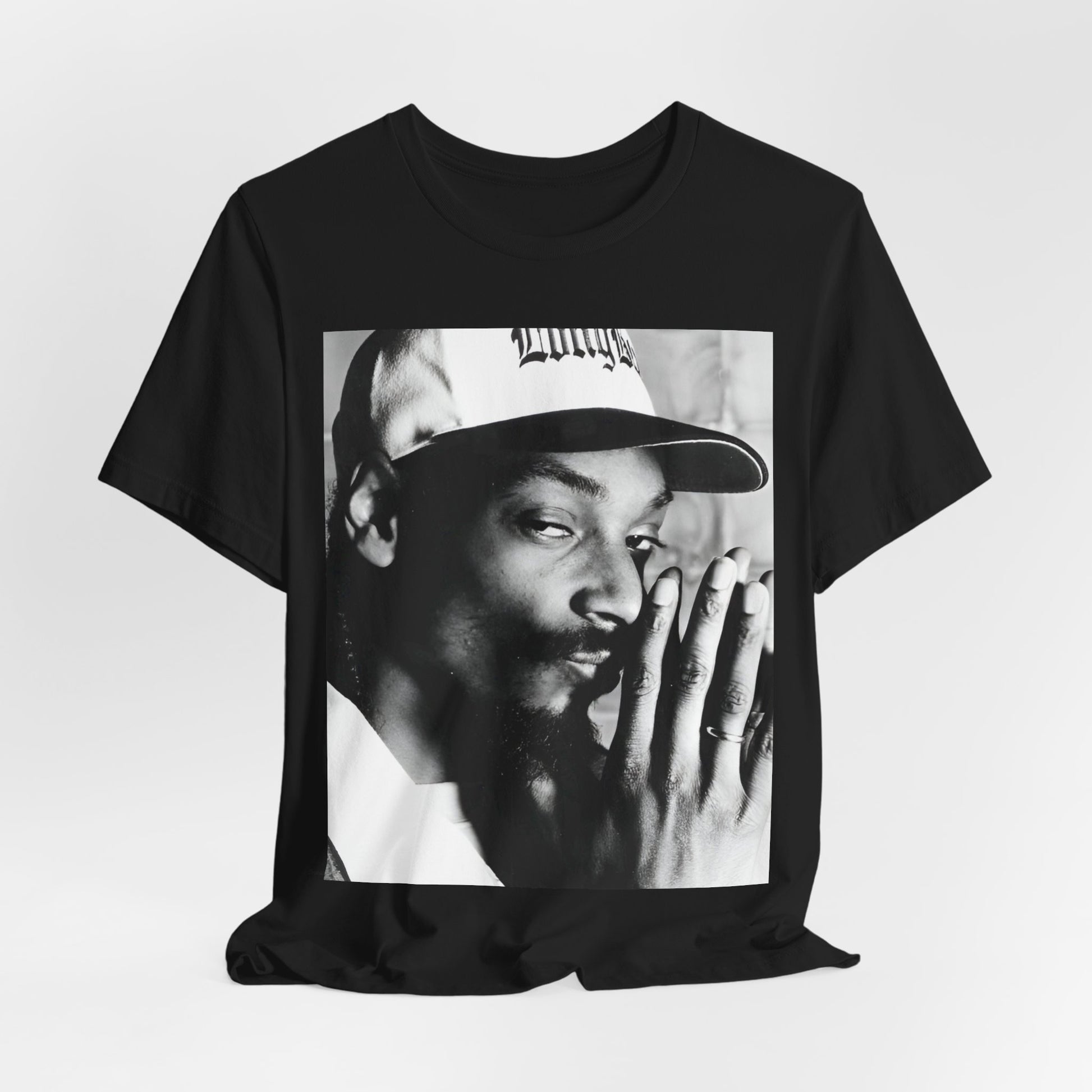 A black graphic t-shirt featuring a cool black and white graphic or photo of Snoop Dogg as a rapper.