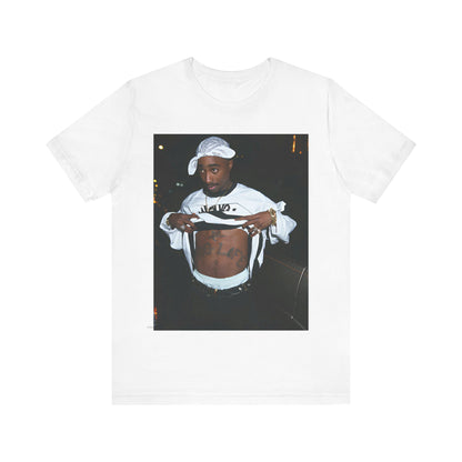 A black graphic t-shirt featuring a graphic of Tupac Shakur (2Pac).