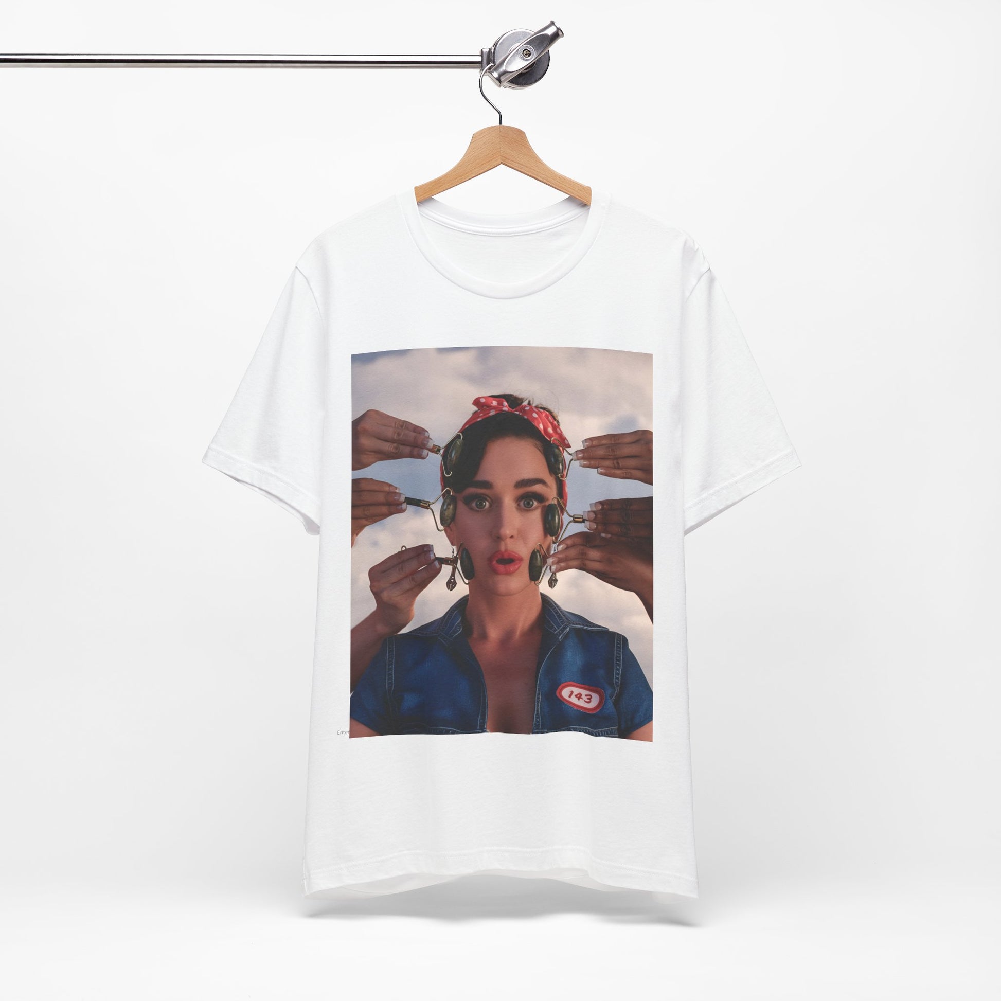 A black graphic t-shirt featuring a modern pop essential graphic of Katy Perry.