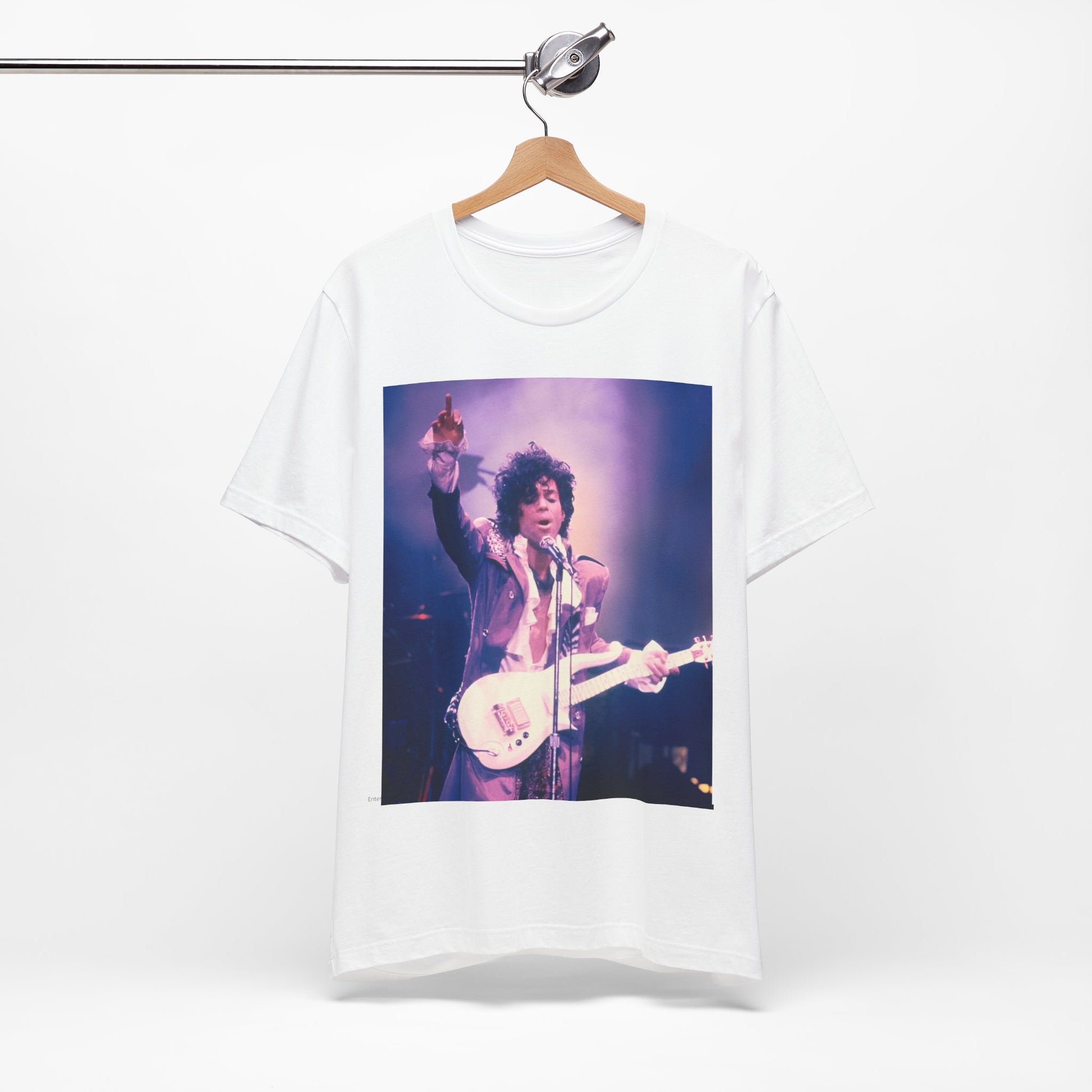 A black graphic t-shirt featuring a boxy graphic with a 'Purple Rain' vibe related to Prince.