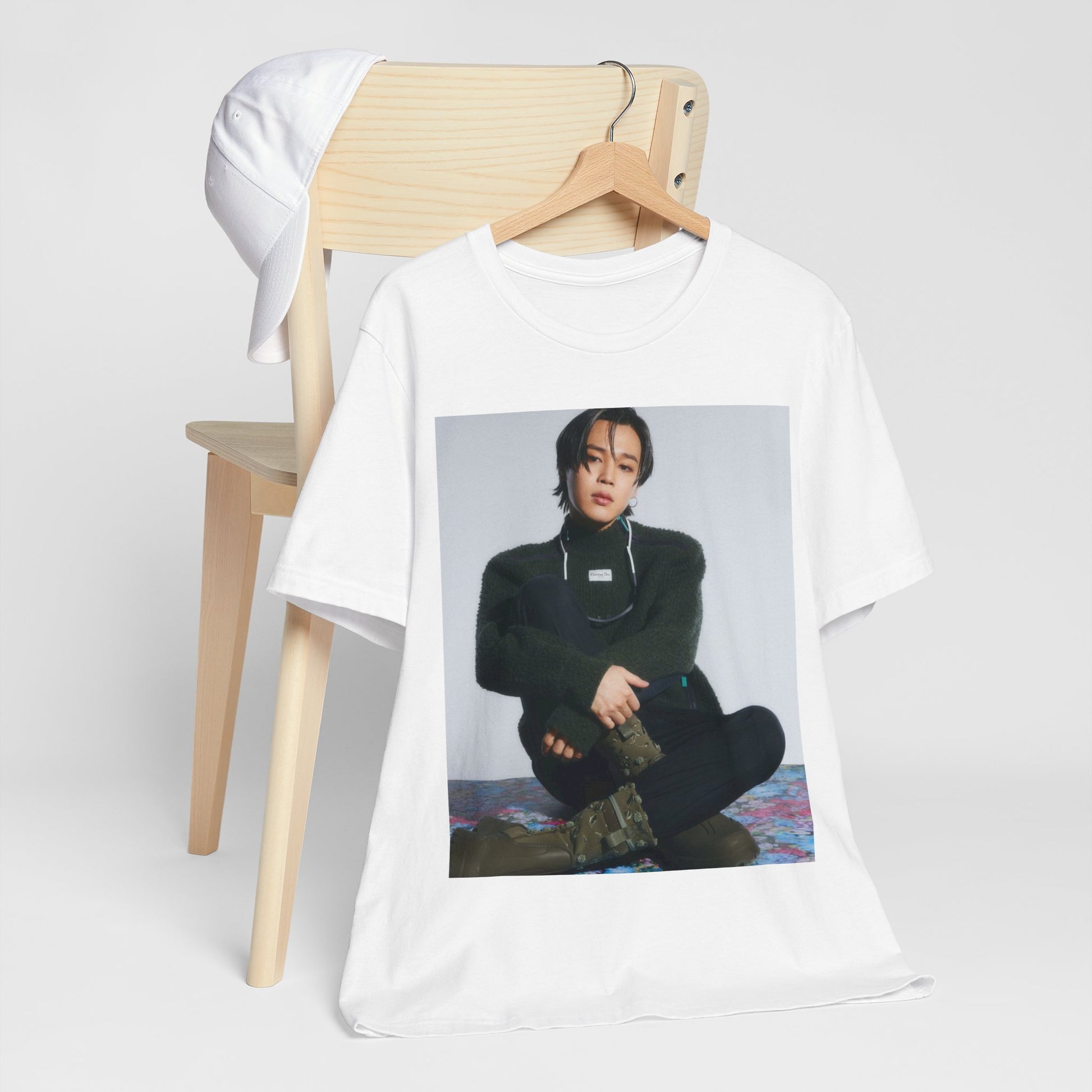 A black graphic t-shirt featuring a modern K-Pop essential graphic of Jimin.