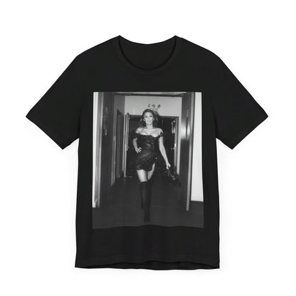 A black graphic t-shirt featuring a black and white graphic of Miley Cyrus in a cool pop rock style.