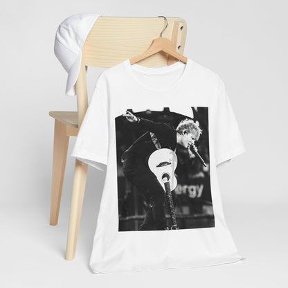 A black graphic t-shirt featuring a vintage graphic of Ed Sheeran performing live.