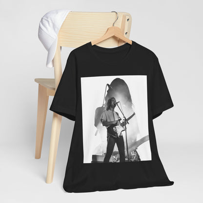 A black graphic t-shirt featuring a black and white, monochrome graphic or photo of Tame Impala.