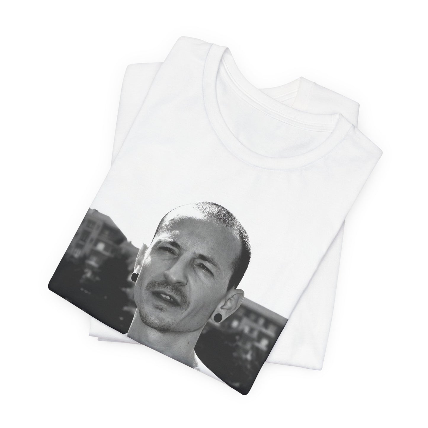 A black graphic t-shirt featuring a black and white graphic or photo portrait of Chester Bennington from Linkin Park.