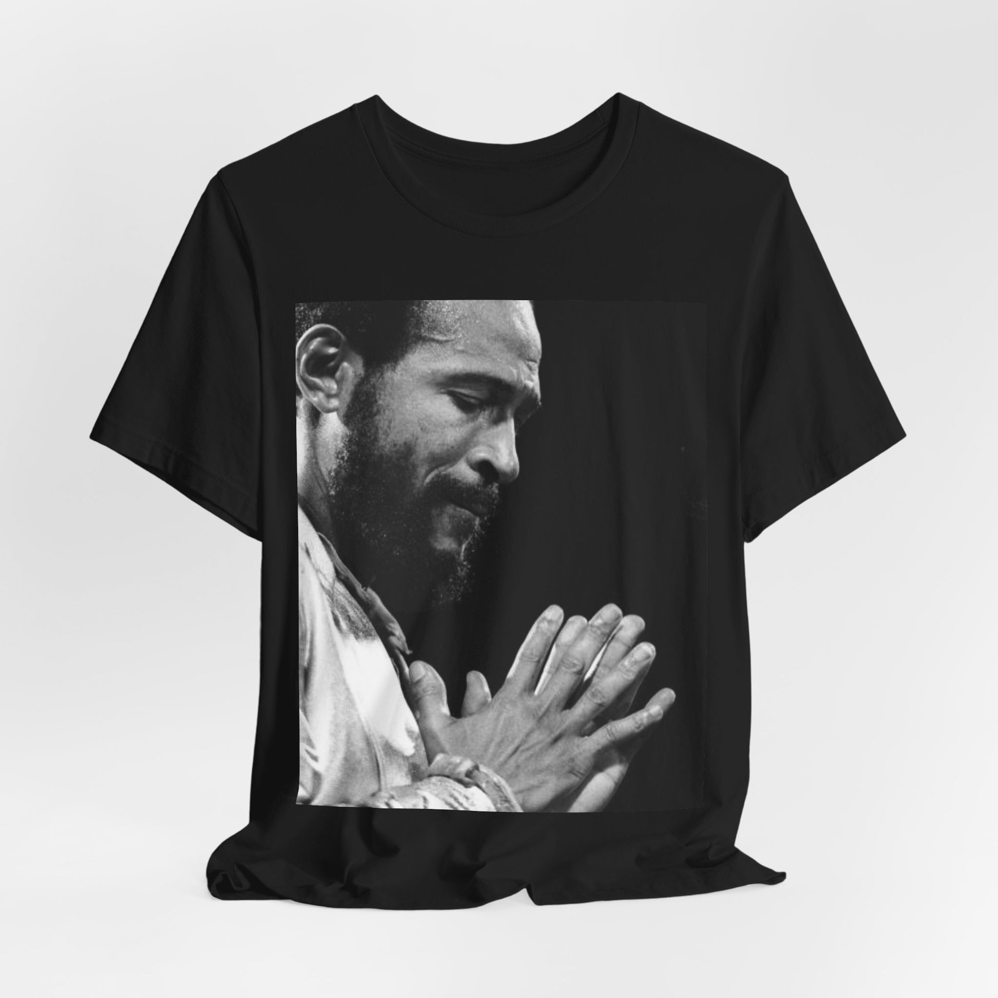 A black graphic t-shirt featuring a 70s graphic of Marvin Gaye emphasizing his soulful voice.