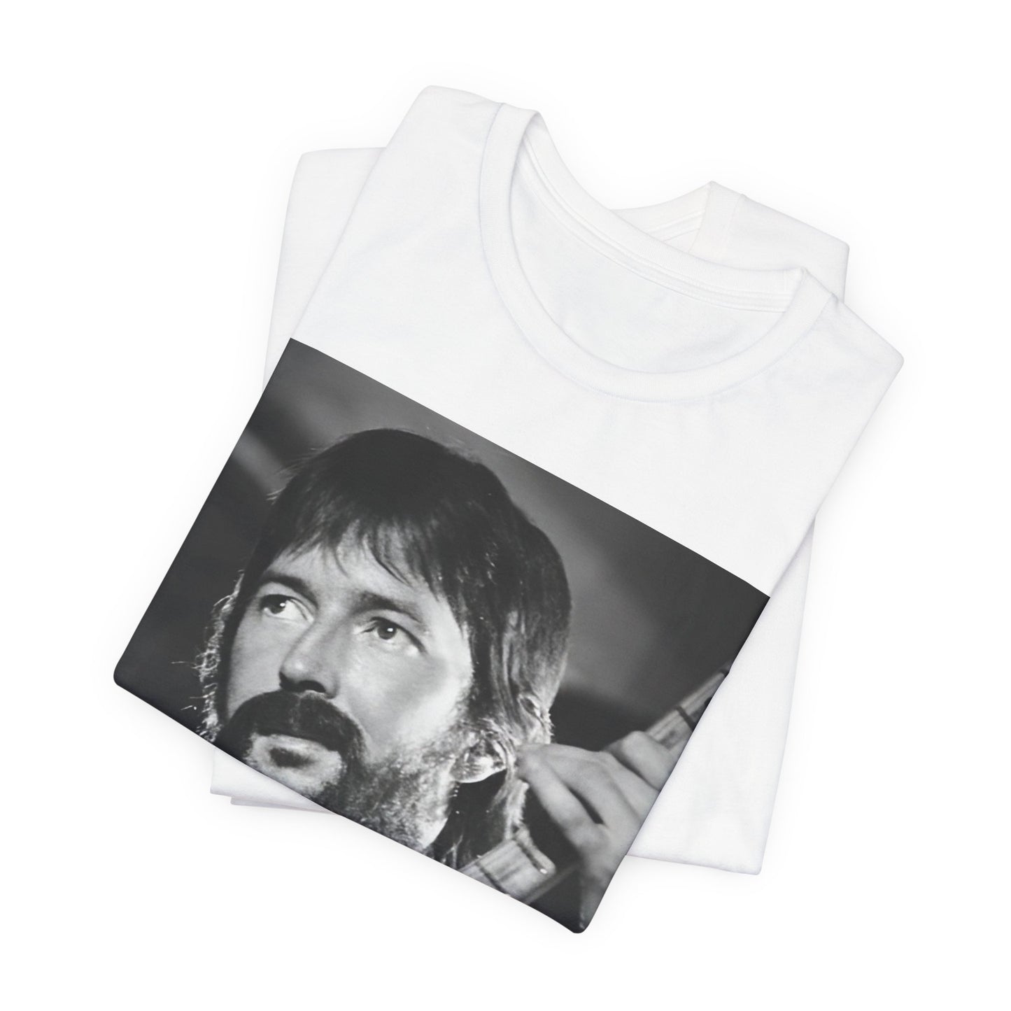 A black graphic t-shirt featuring a graphic of Eric Clapton as an authentic guitar god.