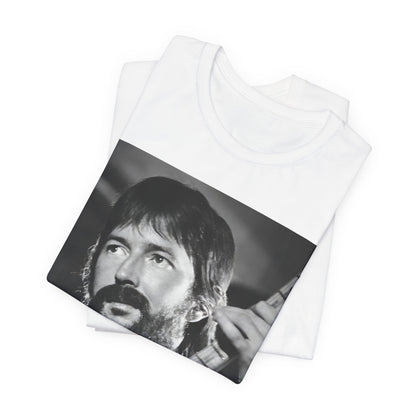 A black graphic t-shirt featuring a graphic of Eric Clapton as an authentic guitar god.