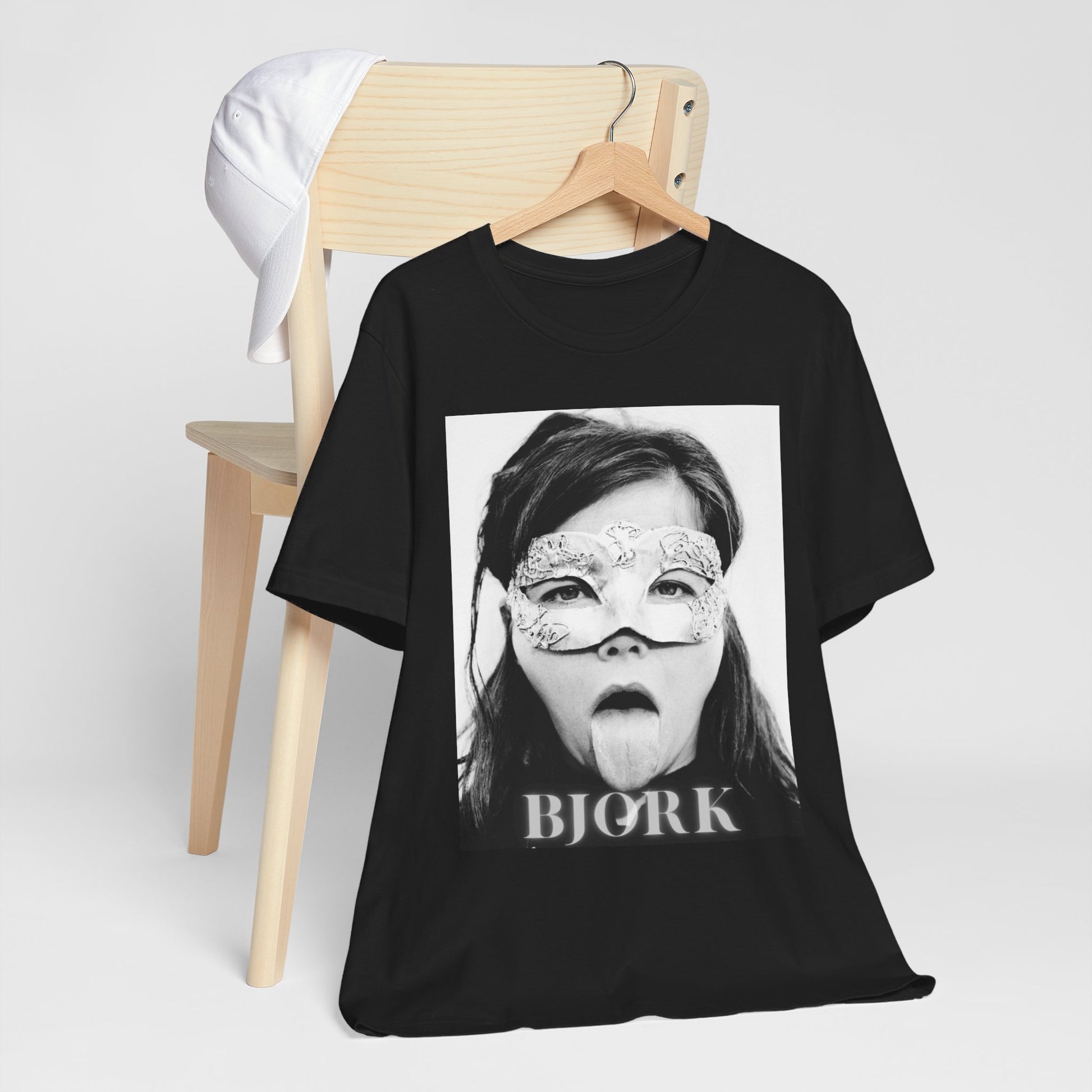 A black graphic t-shirt featuring a black and white portrait photo of Bjork.