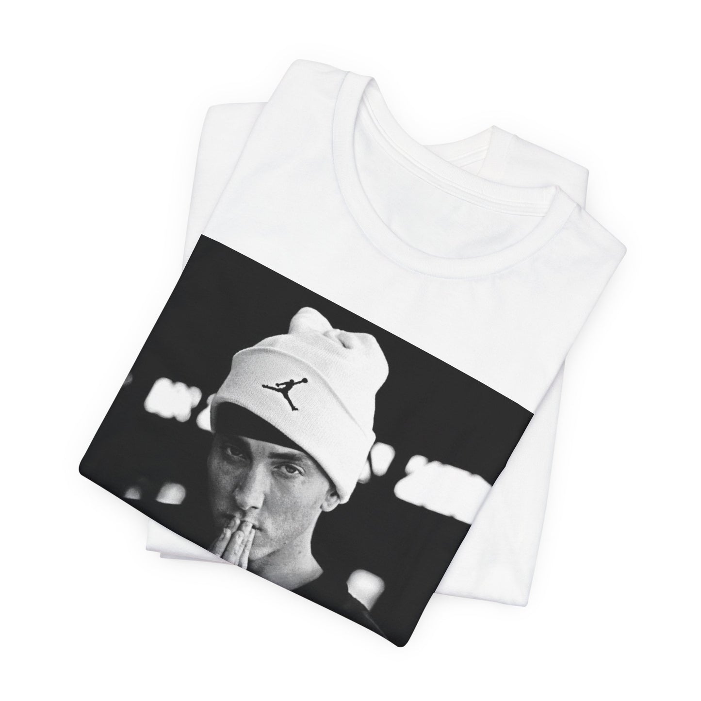 A black graphic t-shirt featuring a black and white portrait photo of Eminem.