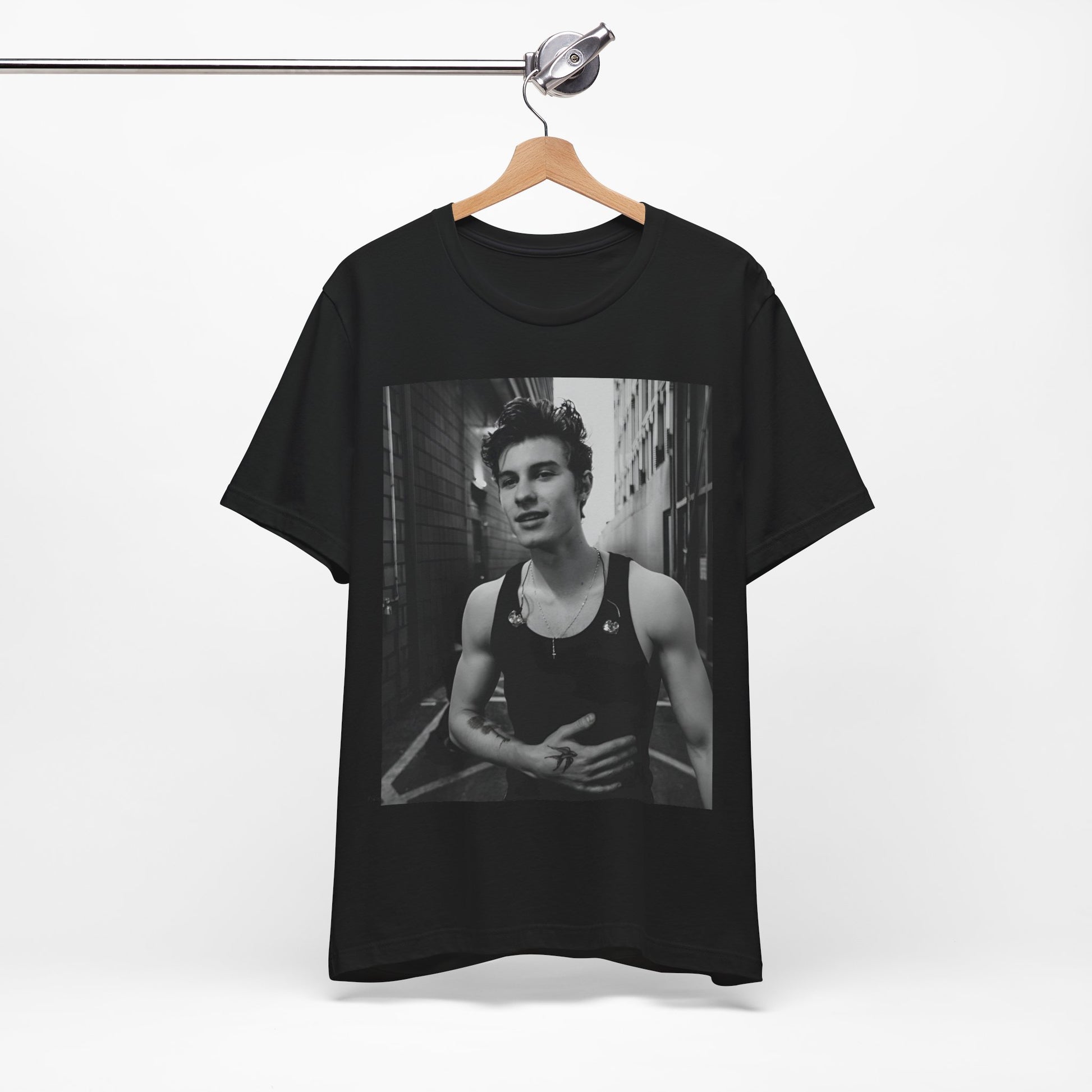 A black graphic t-shirt featuring a vintage black and white portrait graphic or photo of Shawn Mendes.