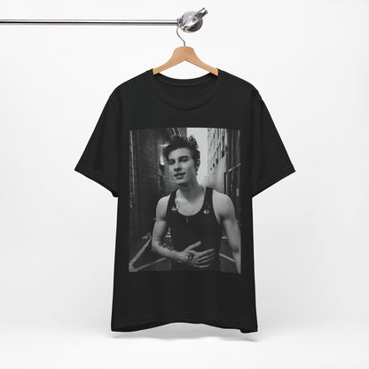 A black graphic t-shirt featuring a vintage black and white portrait graphic or photo of Shawn Mendes.