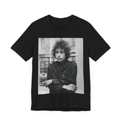 A black graphic t-shirt featuring a black and white graphic of Bob Dylan from the folk revival era.