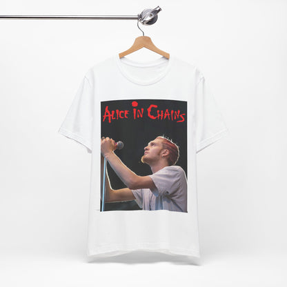 A black graphic t-shirt featuring the Alice In Chains logo in red, in a 90s grunge style.