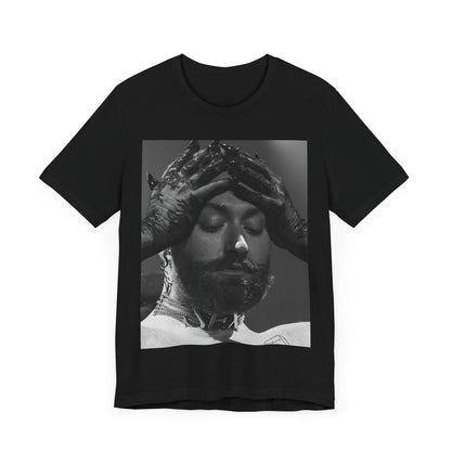A black graphic t-shirt featuring a black and white graphic or photo of Sam Smith performing live on stage.