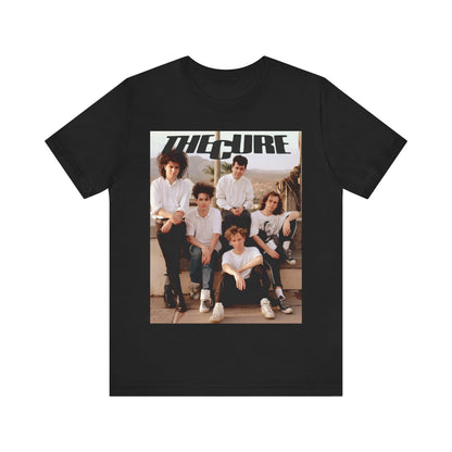 A black graphic t-shirt featuring a vintage graphic of The Cure with a dark romanticism theme.