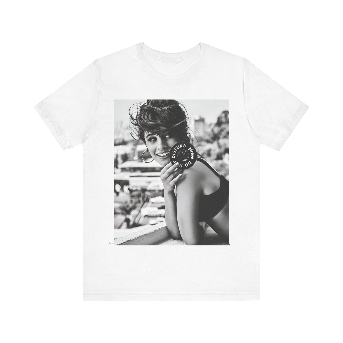 A black graphic t-shirt featuring a black and white photo or graphic of Camila Cabello in an iconic style.