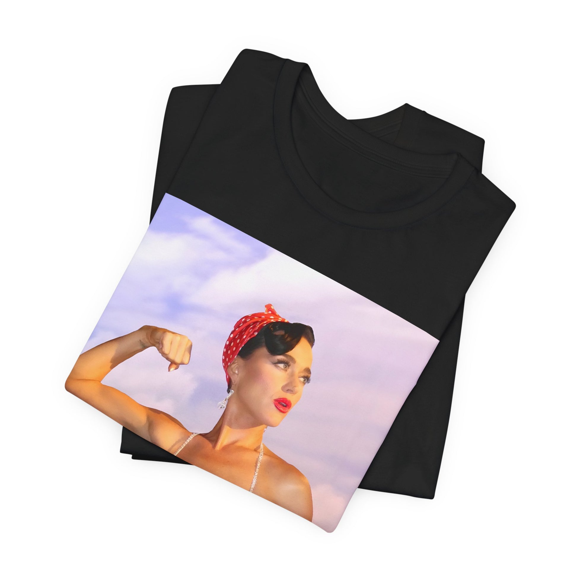 A black graphic t-shirt featuring a bold graphic of Katy Perry as a pop superstar.