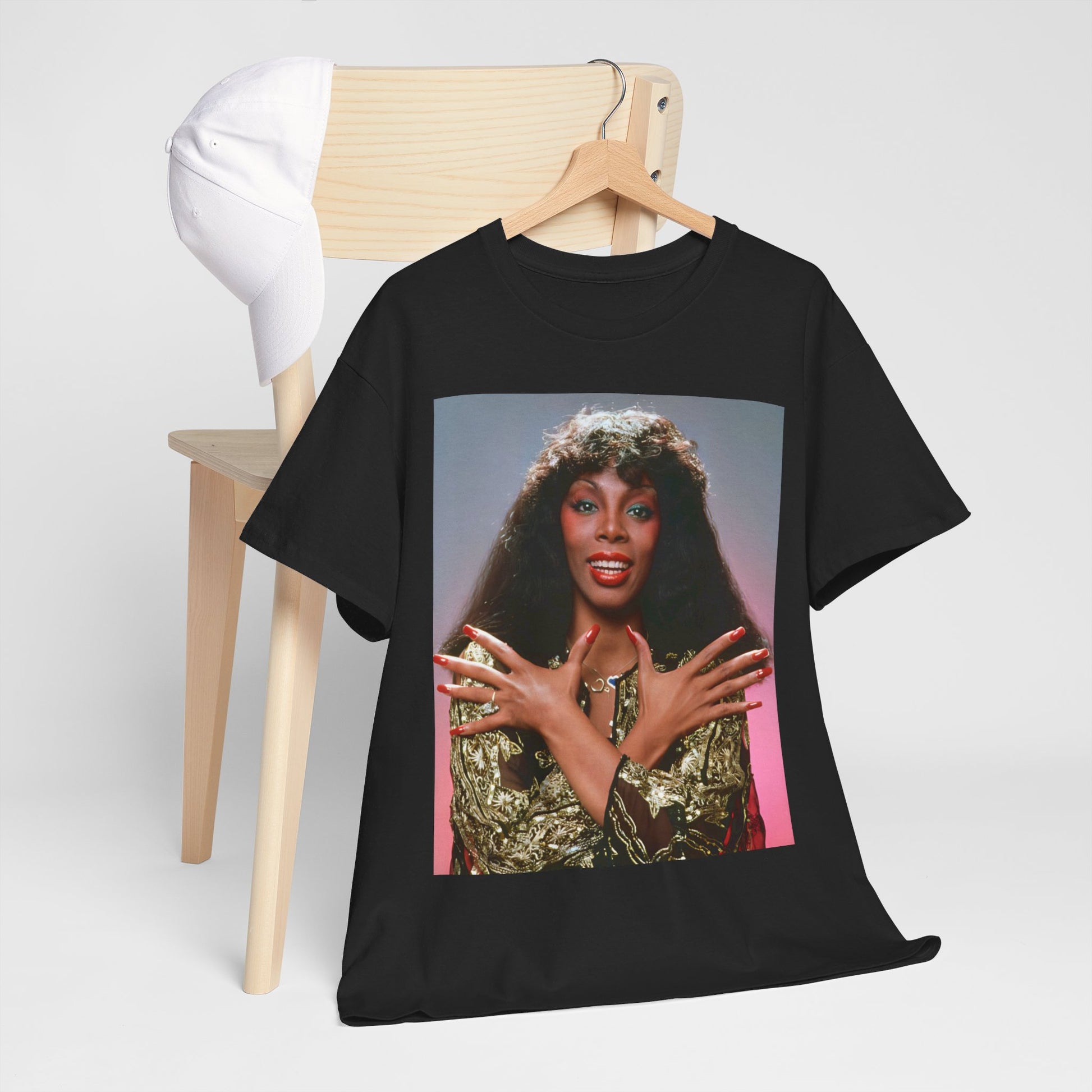 A black graphic t-shirt featuring a retro graphic of Donna Summer as the Queen of Disco.