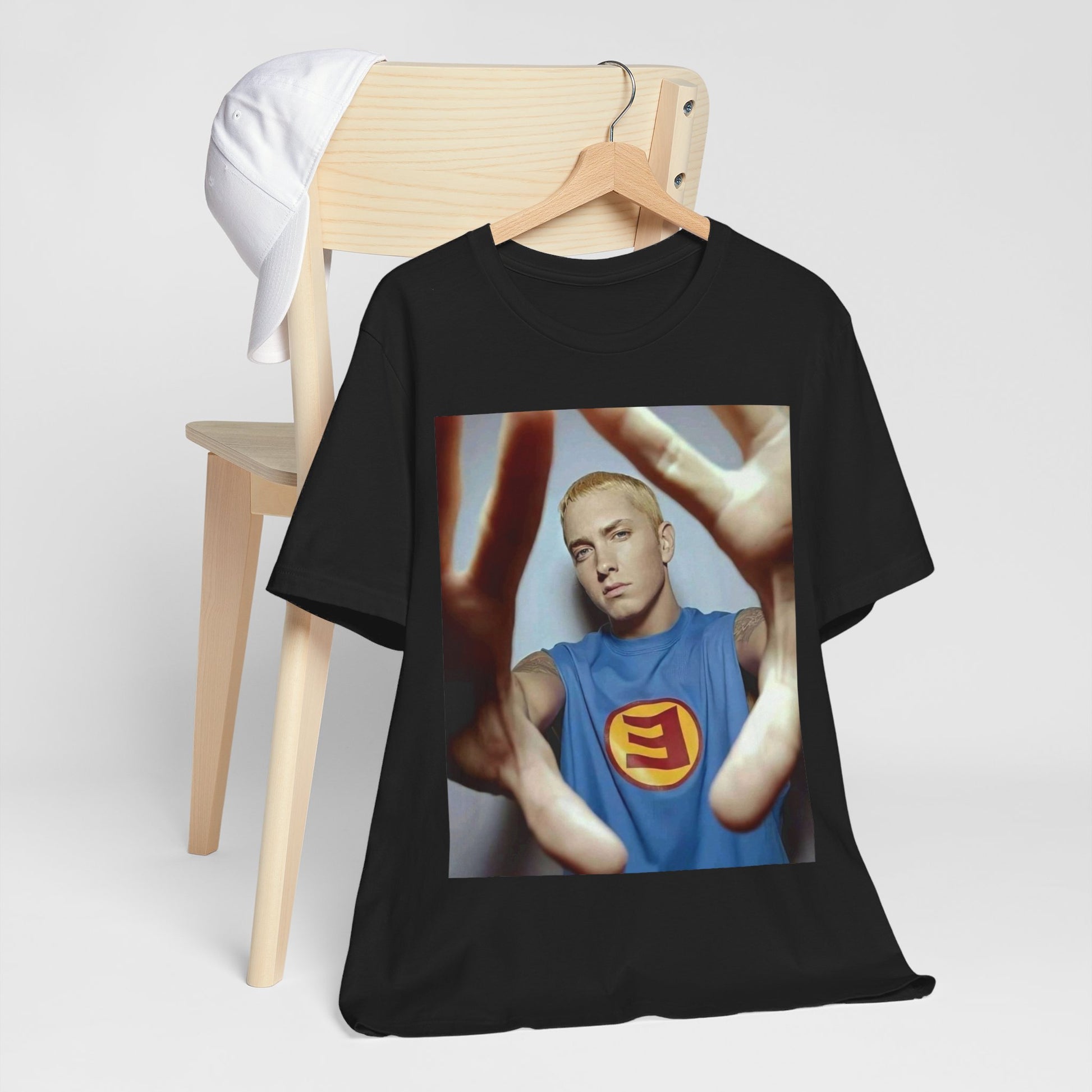 A black graphic t-shirt featuring a graphic related to Eminem's 'The Slim Shady LP' album.