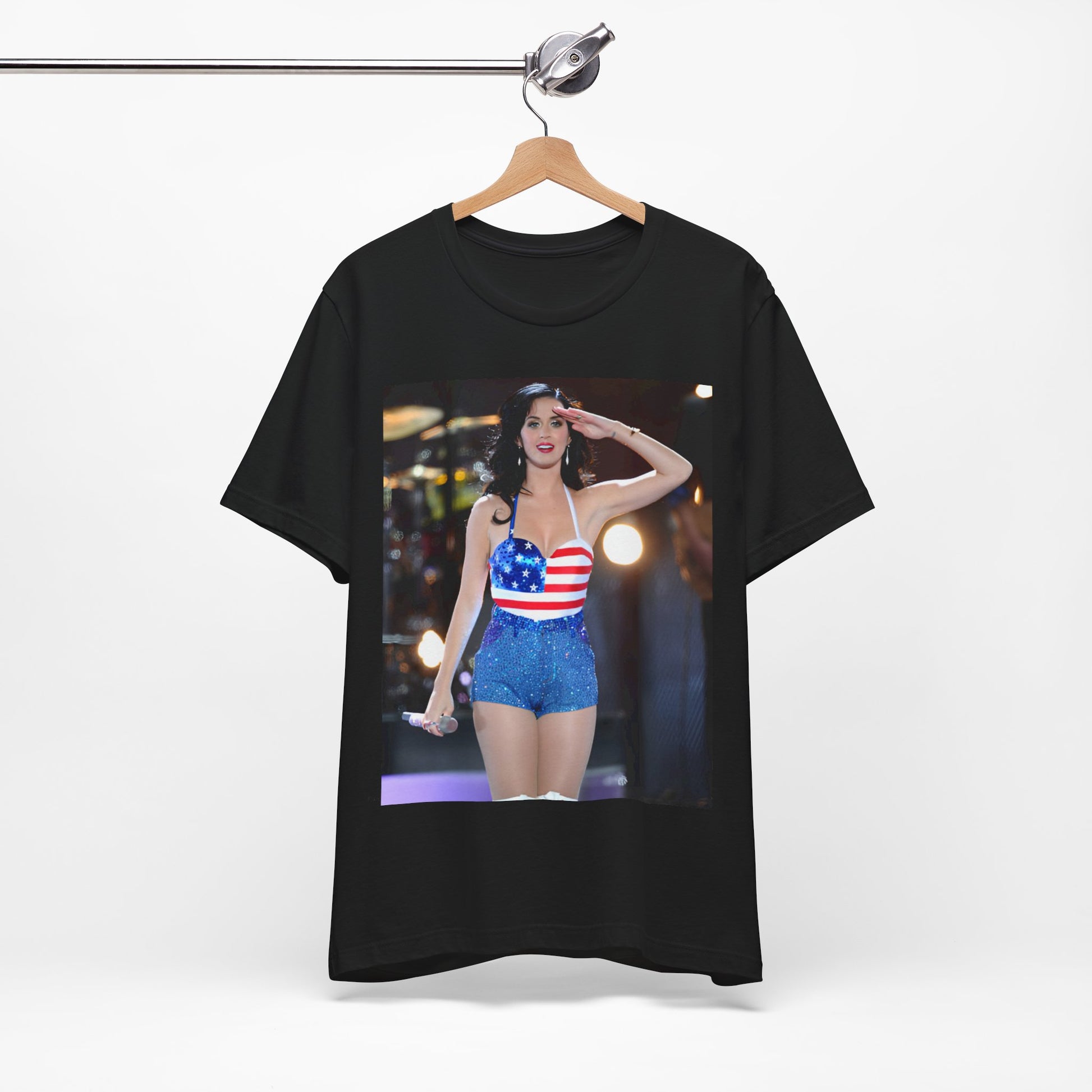 A black graphic t-shirt featuring a vintage graphic related to Katy Perry's 'Firework' song or era.