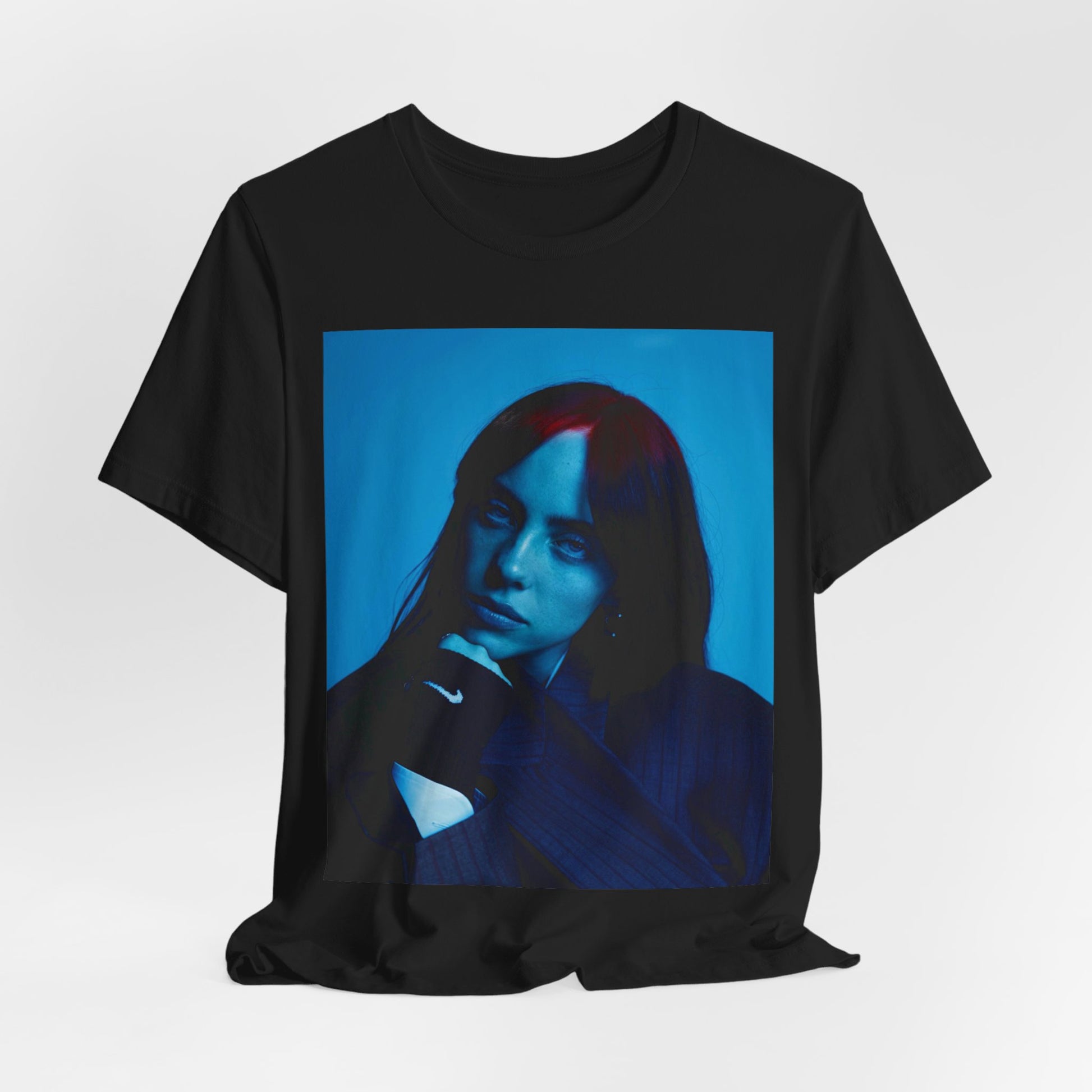 A soft, slightly blurred photo of Billie Eilish, evoking the dreamy and nostalgic feel of her song 'Ocean Eyes,' printed on a t-shirt.