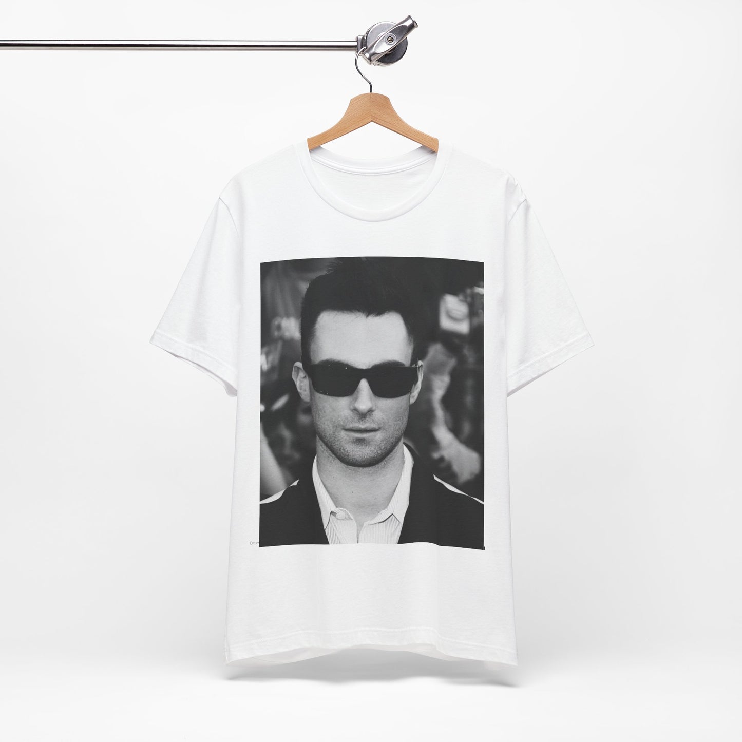 A black and white high-fashion photoshoot photo of Adam Levine, frontman of Maroon 5, looking confidently at the camera.