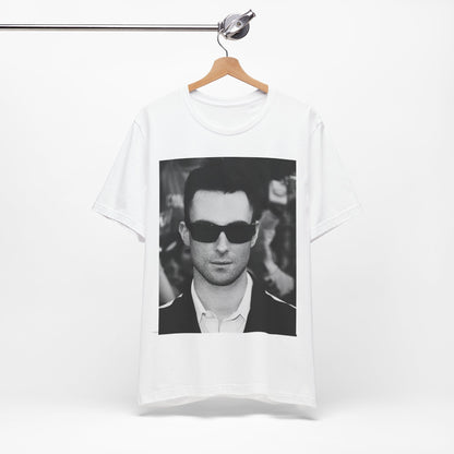 A black and white high-fashion photoshoot photo of Adam Levine, frontman of Maroon 5, looking confidently at the camera.
