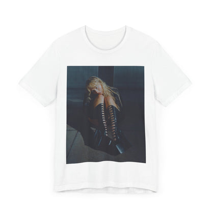 A black graphic t-shirt featuring a bold graphic of Sabrina Carpenter as a pop superstar.