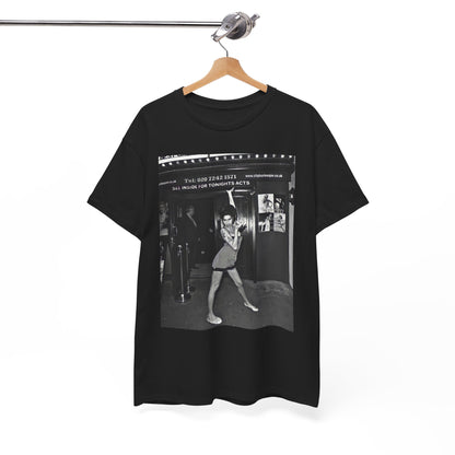 A black graphic t-shirt featuring a black and white graphic of Amy Winehouse in a burlesque club setting, stylized to evoke that ambiance.