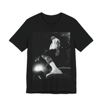 The abstract, geometric 'V' logo from the cover of the Maroon 5 album V, printed on a t-shirt.