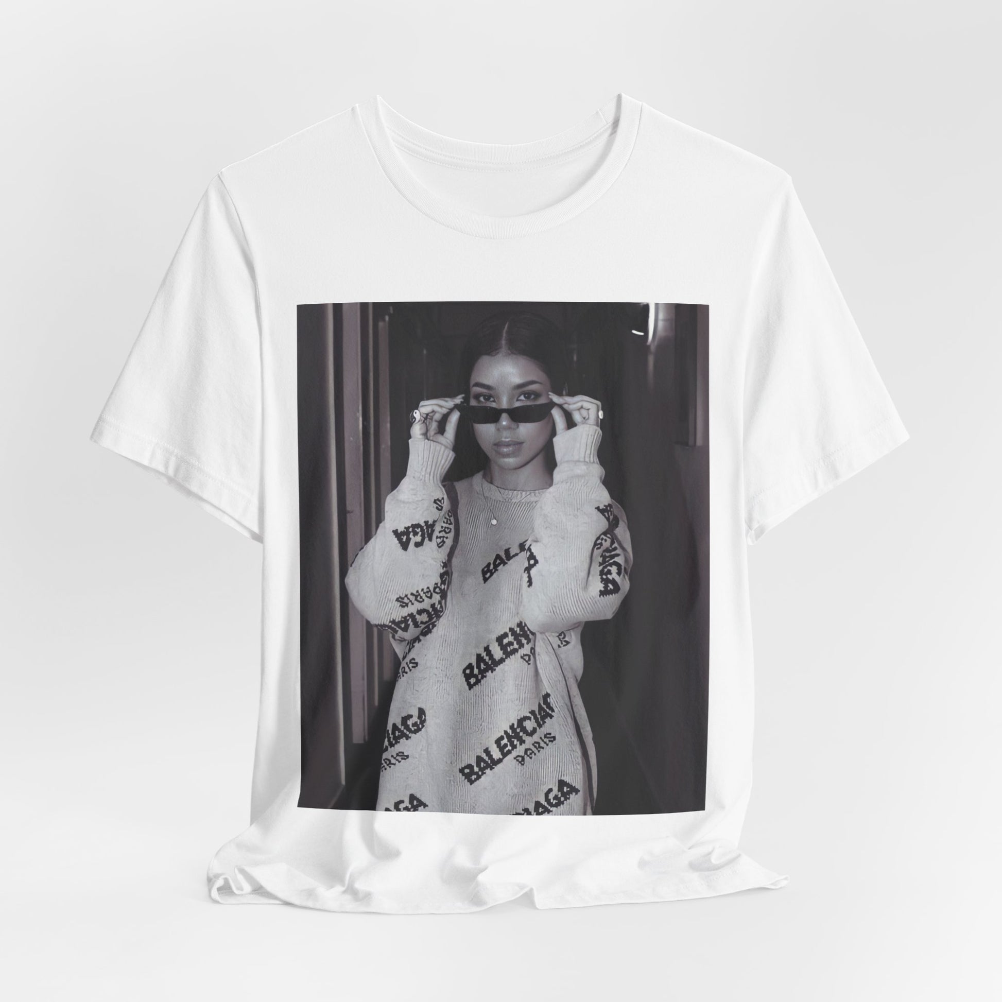 A black graphic t-shirt featuring a black and white, monochrome graphic or photo of Jhene Aiko.