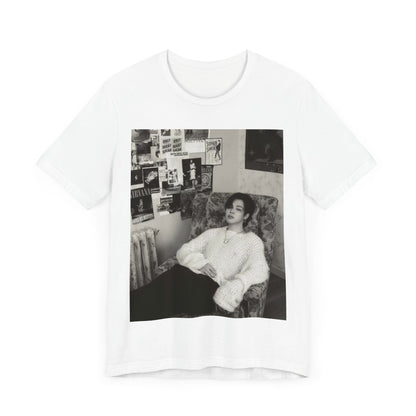 A black graphic t-shirt featuring a black and white portrait photo of Jimin.
