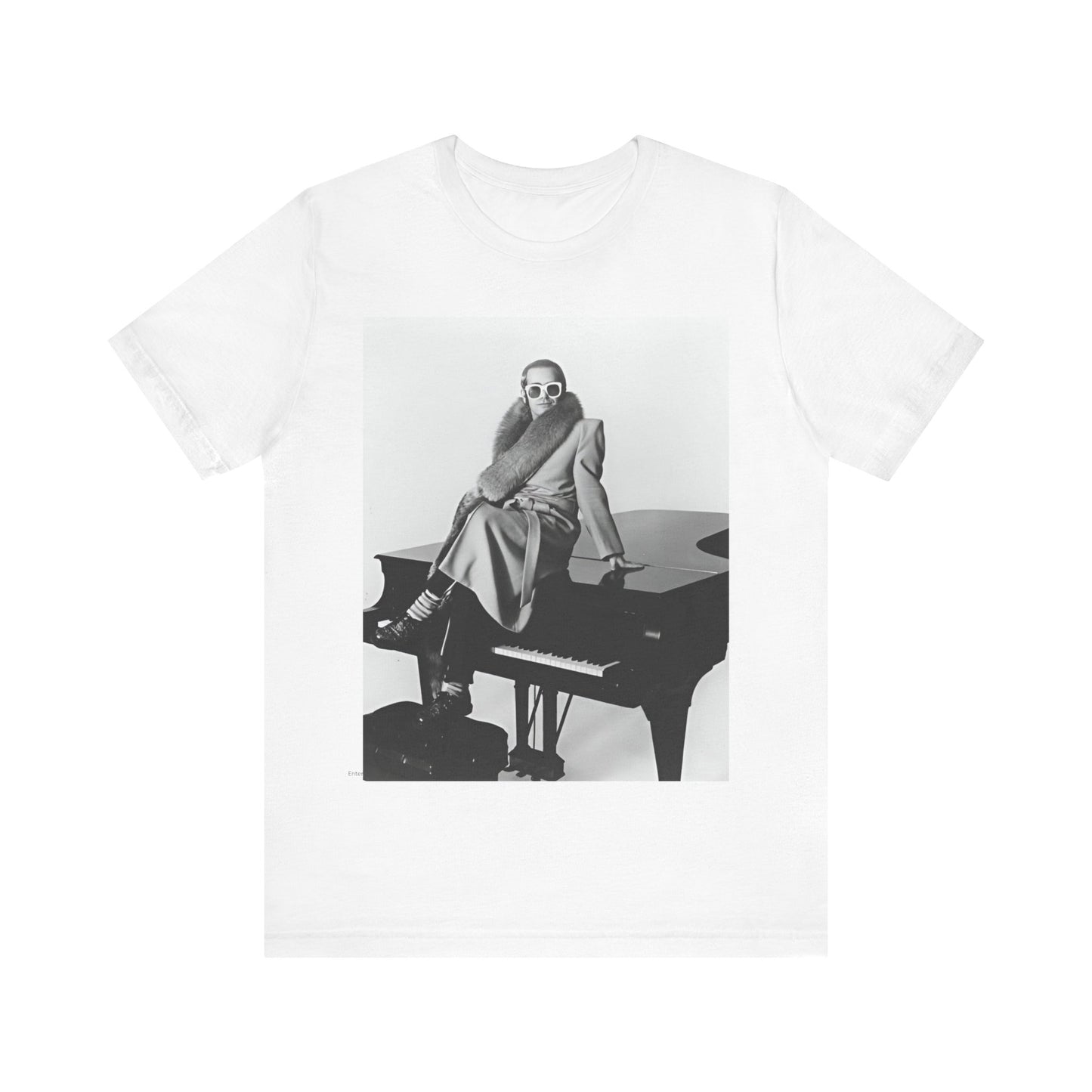 A black graphic t-shirt featuring a black and white photo of Elton John playing the piano.