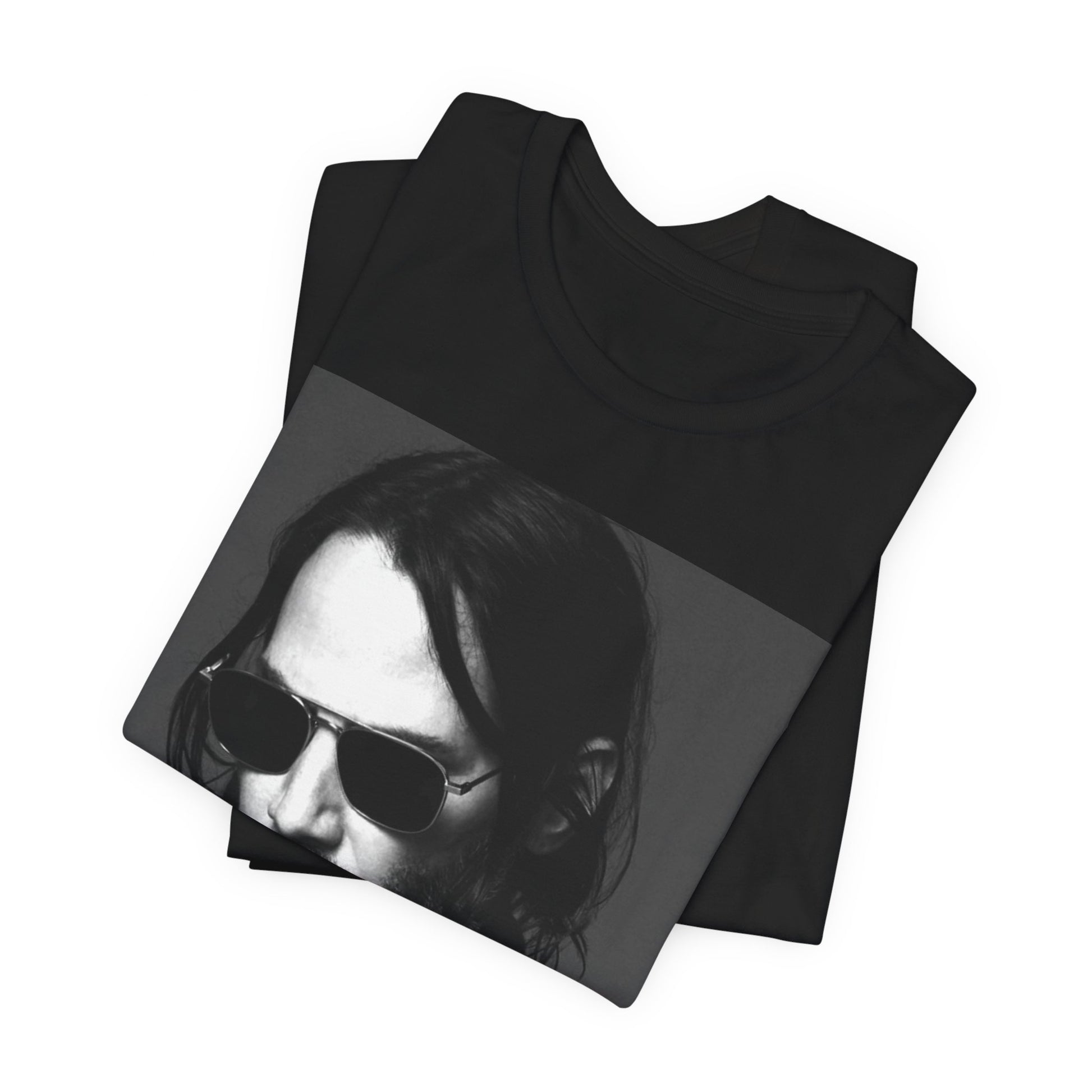 A black graphic t-shirt featuring a graphic of Keanu Reeves with a rebel spirit aesthetic.