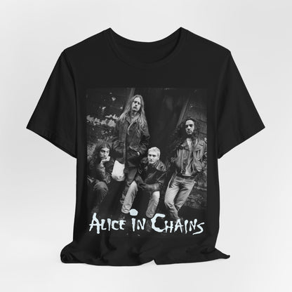A black graphic t-shirt featuring a 90s black and white photographic portrait of the band Alice In Chains, capturing their iconic grunge look.