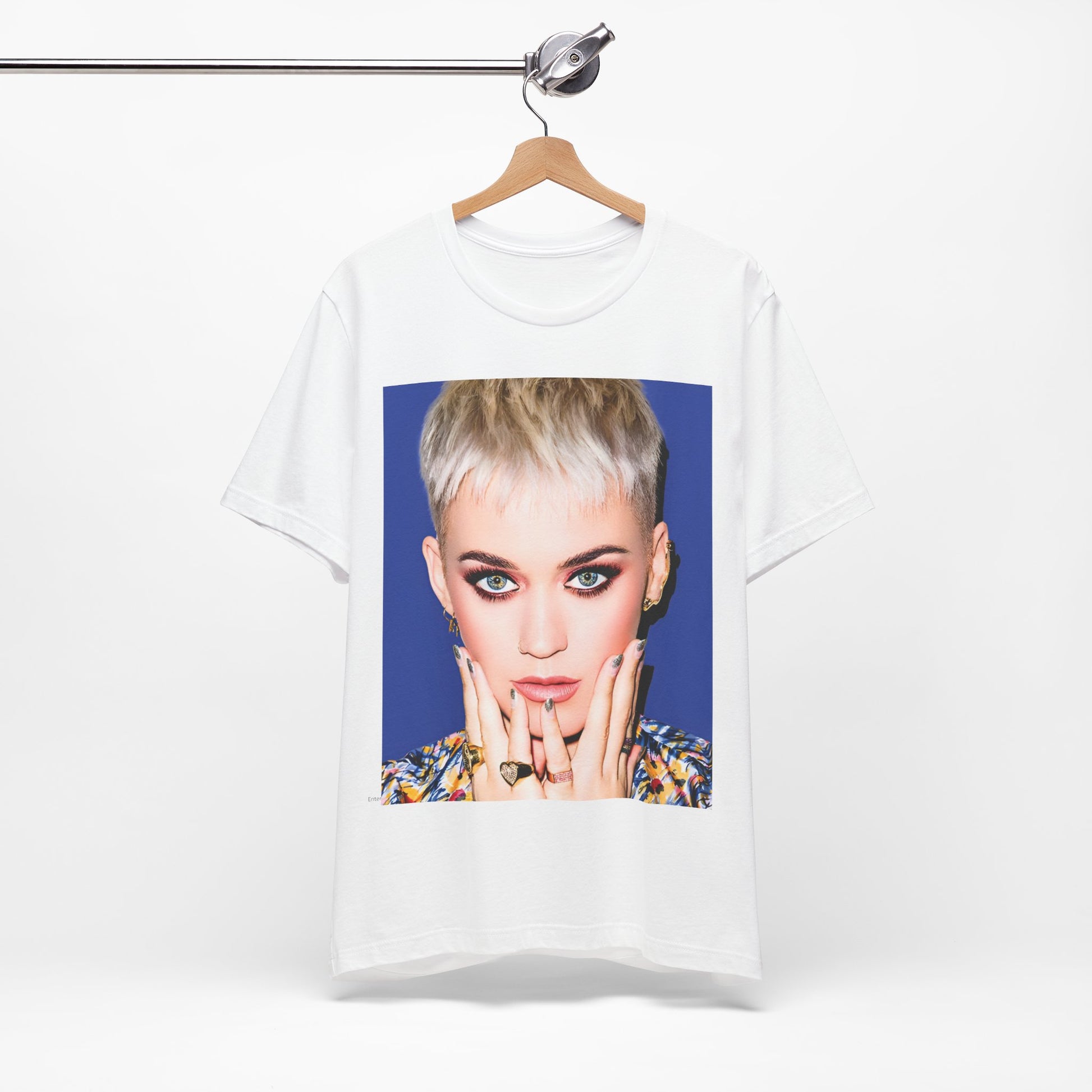 A black graphic t-shirt featuring a graphic of Katy Perry as a global pop phenomenon.