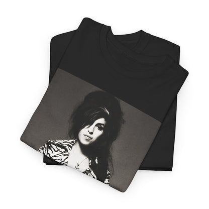A black graphic t-shirt featuring a vintage black and white portrait of Amy Winehouse, showing her with her signature beehive and soulful expression.