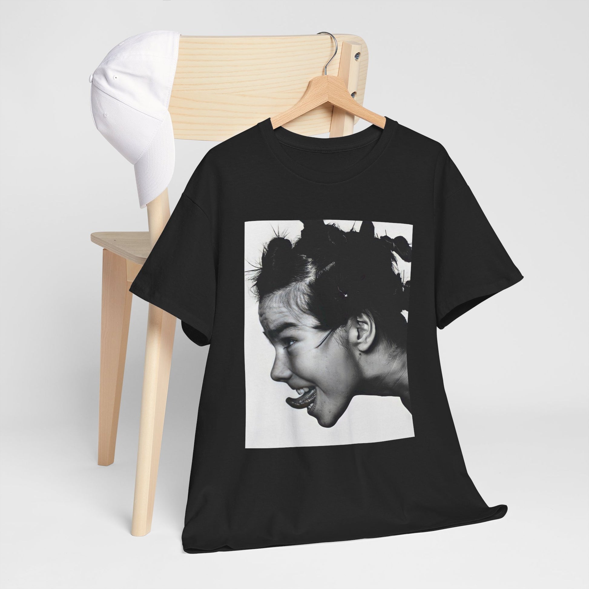 A black graphic t-shirt featuring a graphic of Bjork, designed with an indie 90s aesthetic.