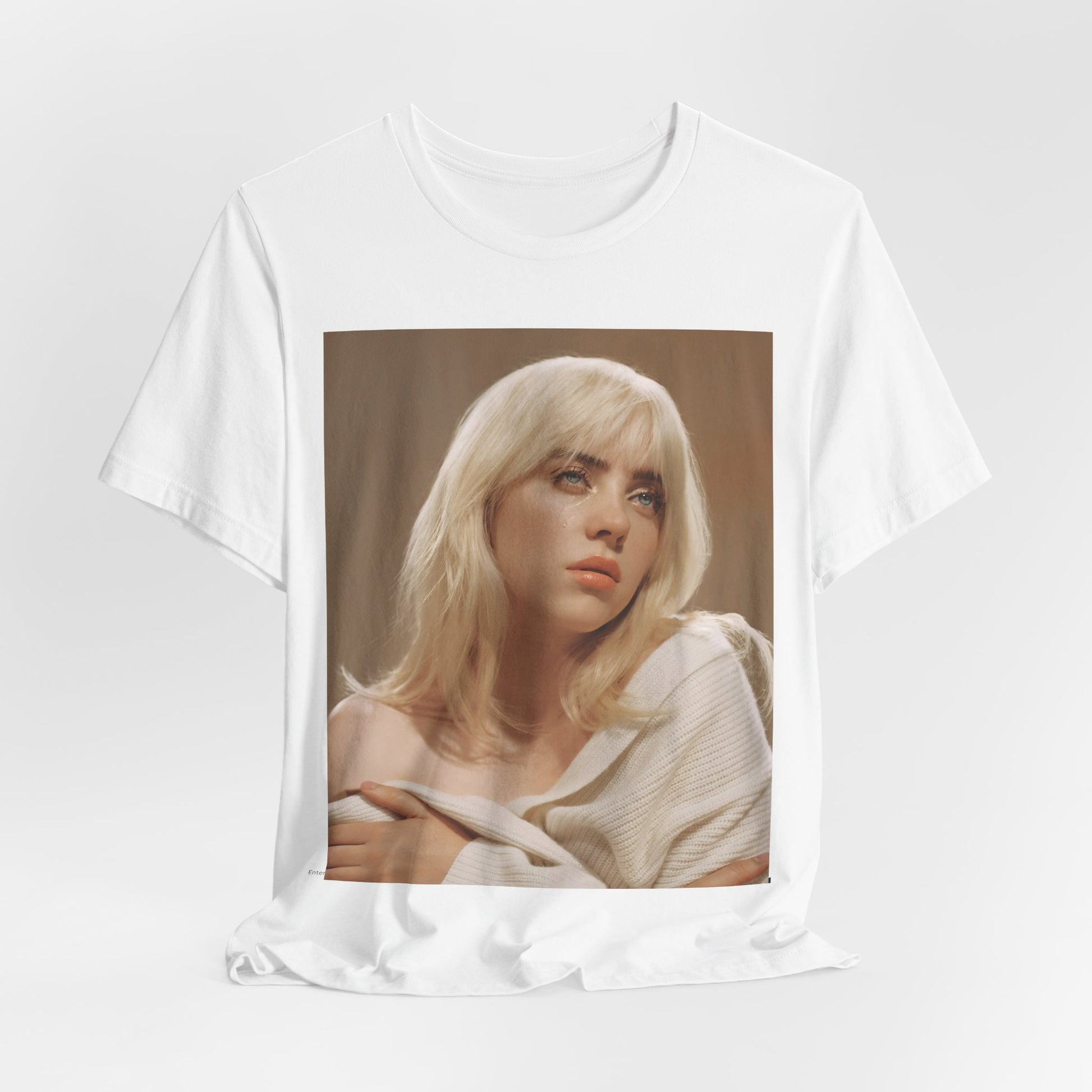 The iconic visual of Billie Eilish with black tears streaming down her face from the 'when the party's over' music video, printed on a t-shirt.
