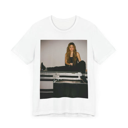 A black graphic t-shirt featuring a modern pop essential graphic of Shakira.